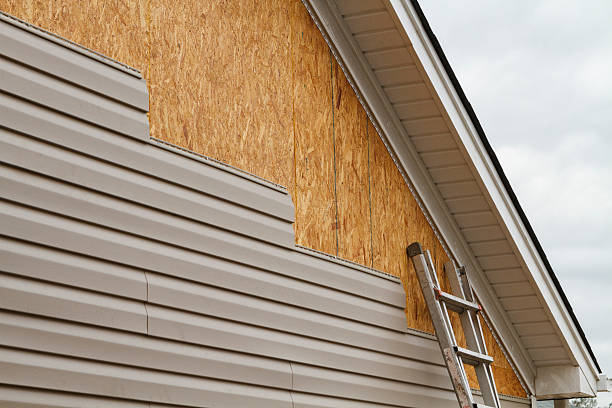Professional Vinyl Siding technician working in Cranesville, PA